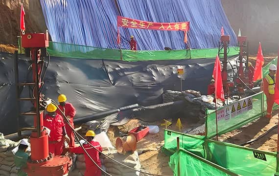 Full overview of a live hot tapping and stoppling operation on a petroleum pipeline, showcasing organized worksite and specialized equipment setup.