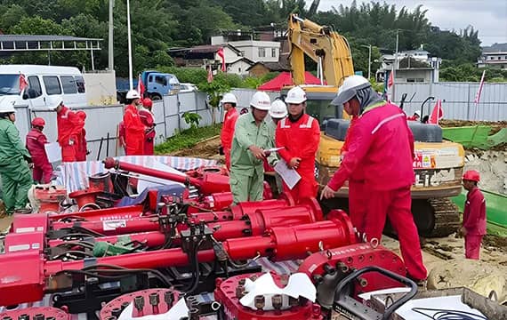 Technician installing a stoppling head into the pipeline, part of the double block and bleed isolation process.