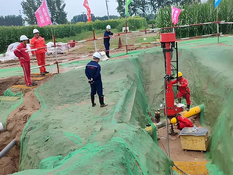 Specialized hot tapping machine performing a connection on the live, high-pressure crude oil pipeline without shutdown.