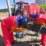 A certified welder executing a high-integrity weld on the 1.6 MPa natural gas pipeline, showcasing our pipeline engineering services expertise.
