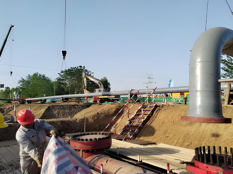 Worker preparing pipeline parts at the site of abandoned pipeline disposal for pipeline hazard management