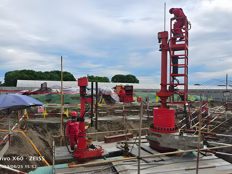 Red pipeline hot tapping and plugging equipment and workers at crude oil pipeline integrity maintenance site