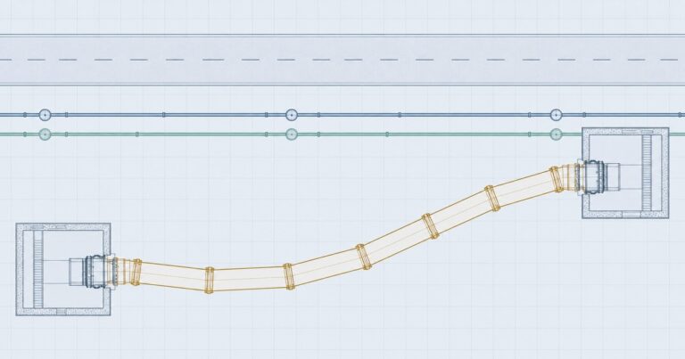 Plan view of a curved microtunneling drive showing a horizontal curve between two shafts and the jacking pipe string