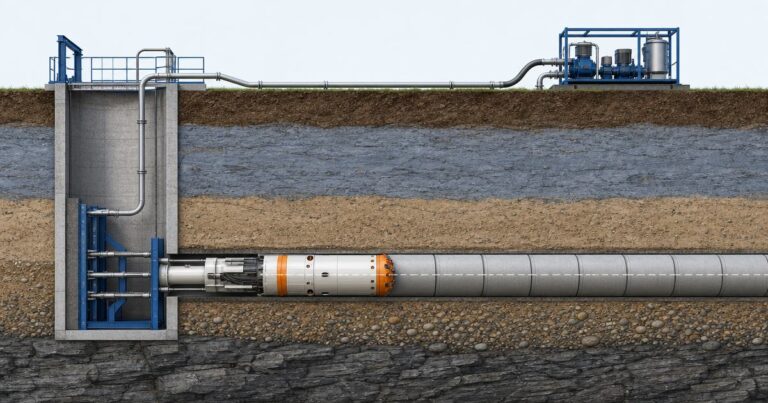 Cross-section of a microtunneling drive showing the machine advancing from a launch shaft with jacked pipe behind it