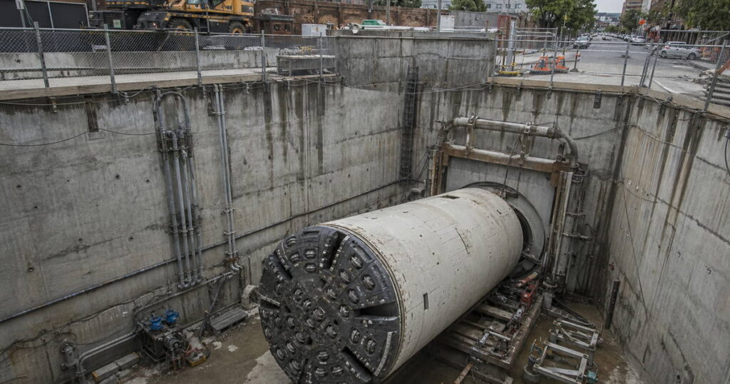 Guided microtunneling machine launching from an urban shaft to install a large-diameter stormwater trunk below a city